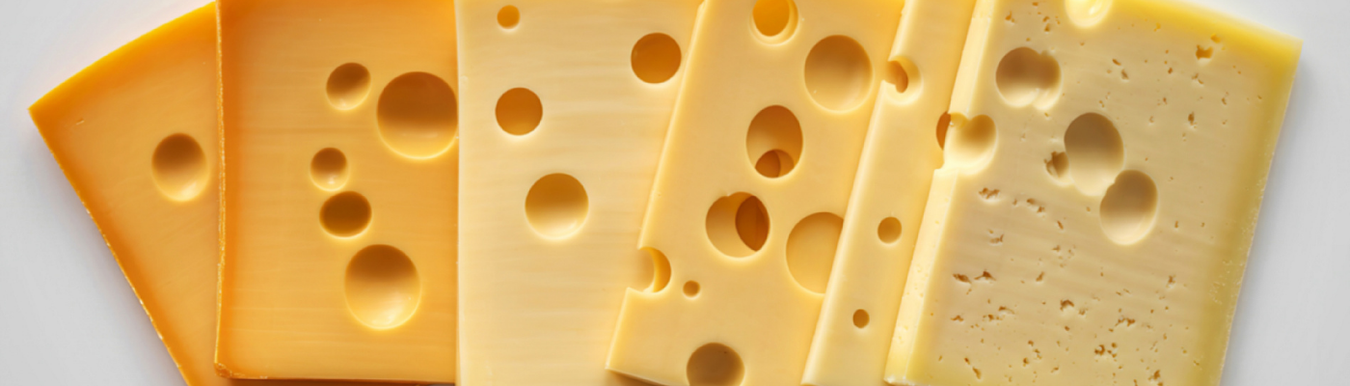 slices of vegan cheese with holes in