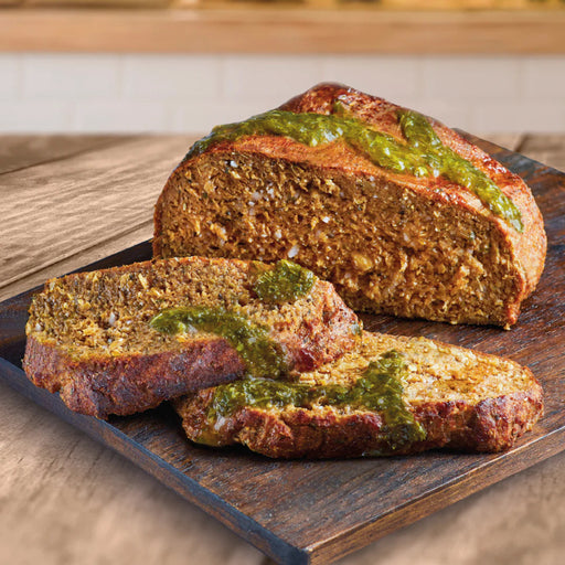 slived vegan lamb joint on wooden board