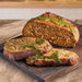 slived vegan lamb joint on wooden board