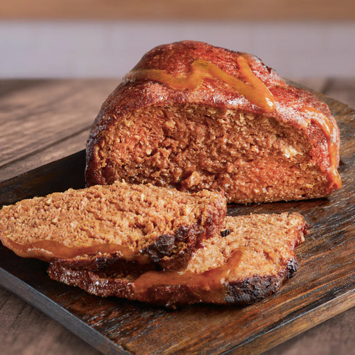 vegan beef joint sliced on wooden board