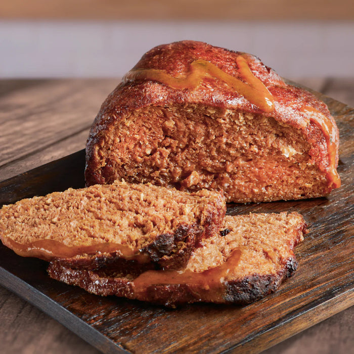 vegan beef joint sliced on wooden board
