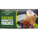 Packaging for Plantside Plant-Based American Style Pancakes showing a stack of pancakes with whipped cream and berries on top, alongside ingredients like blueberries and strawberries.