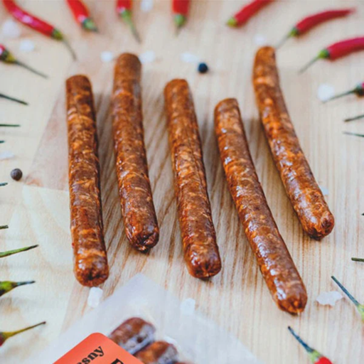 plenty reasons chilli kabanos sausages on a table surrounded by chillies