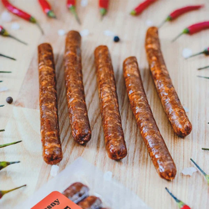 plenty reasons chilli kabanos sausages on a table surrounded by chillies