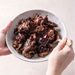 bowl of vegan mushroom meaty brisket in bbq sauce