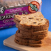 Ezekiel 4:9 cinnamon raisin bread stacked up on a breadboard with the packet in the background