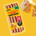 plenty reasons cheese flavoured kabanos sausages pack on a yellow background with a chunk of cheese in the foreground