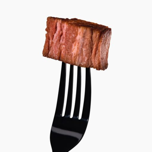 a slice of juicy marbles filet on a fork