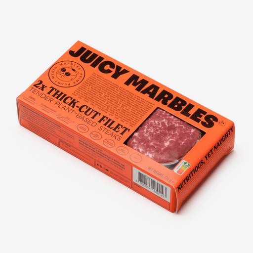 Packaging of Juicy Marbles 2 Thick Cut Filet, displaying the product name and a window showing the plant-based, vegan steak inside.